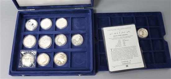 A cased collection of 900 and 925 standard Chinese proof silver commemorative coins